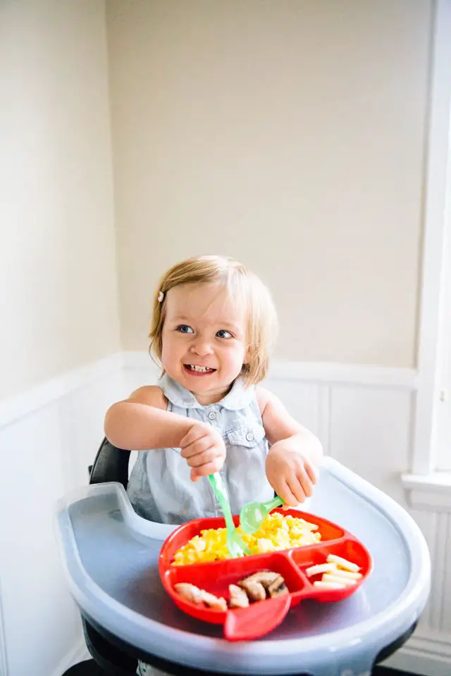 baby-eating-baby-friendly-snack-to-keep-baby-safe-and-happy-on-halloween
