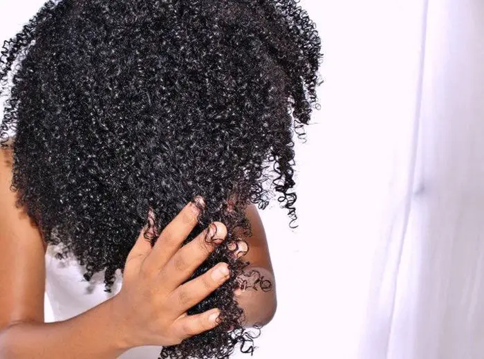 using-hand-to-to-massage-her-hair