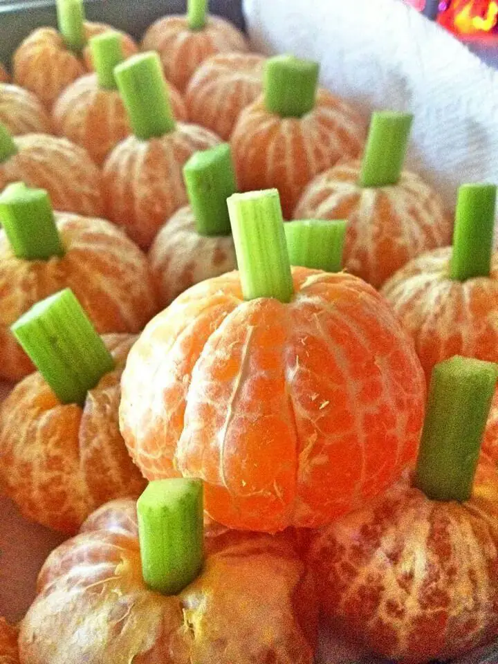 pumpkin-orange-with-celery-stems-halloween-treats-for-kids-parties