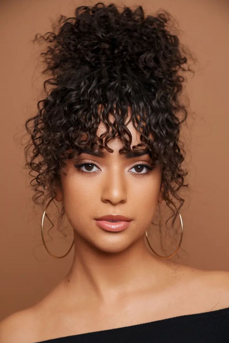 high-bun-with-curl-fringe