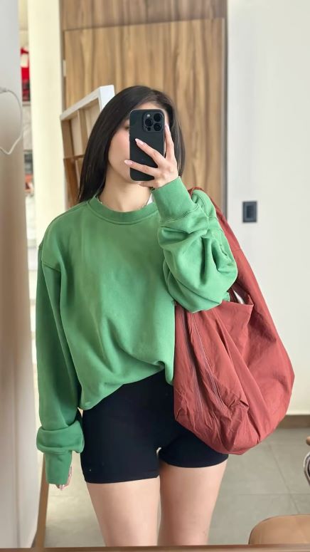 Oversized-Green-Sweatshirt-with-Biker-Shorts-cute st.patrick's-daycollege-outfit