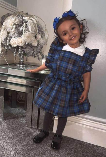 plaid-pinafore-dress-layered-over-a-top-throwback-kids-fashion-outfit