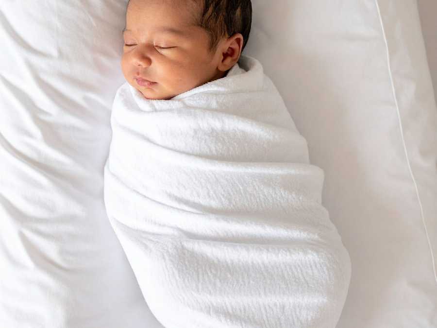 Swaddling-can-provide-comfort-newborn-sleep-tips